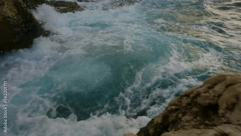 Rocky coast with waves on Mediterranean Sea. Italy, Europe. Nature Background. Sunset Sky. Slow Motion Cinematic Rocky coast with waves on Mediterranean Sea. Italy, Europe. Nature Background. Sunset Sky. Slow Motion Cinematic