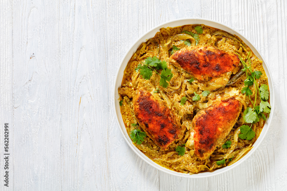 Cheesy Salsa Verde Chicken in dish, top view Cheesy Salsa Verde Chicken in dish, top view