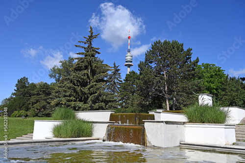 Tv tower  Donauturm and fountain in Donaupark Vienna photo