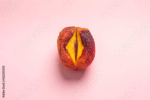 Flat lay composition with ripe peach on a orange background. Sex concept photo