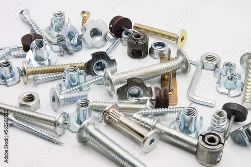 Furniture fittings. Furniture assembly hardware options and tools on a white background. Large selection of furniture accessories.