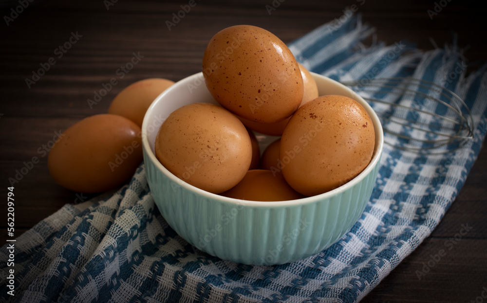 Fresh eggs in a bowl on a dark background Fresh eggs in a bowl on a dark background