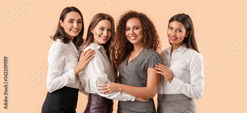 Pretty young women on beige...
