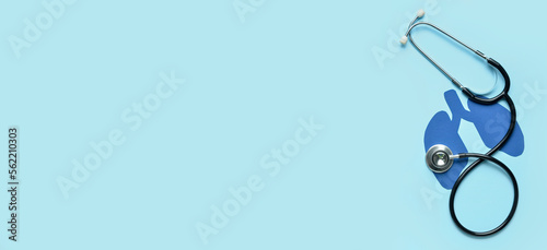 Foto Paper lungs and stethoscope on light blue background with space for text