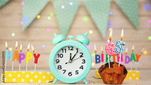 Happy birthday greeting card with muffin pie and retro clock on clock hands new birth. Beautiful background with decorations festive happy birthday decoration with number 65