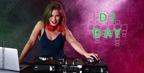 Female dj playing music in ...