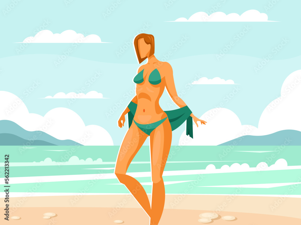 Beautiful woman in bikini stands on the beach against the backdrop of the sea or ocean