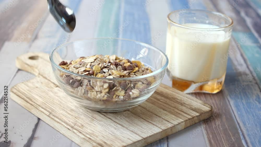 granola Musli and glass of milk on table granola Musli and glass of milk on table