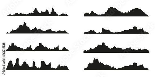 Mountains silhouettes on the white background. Wide semi-detailed panoramic silhouettes of highlands  mountains and rocky landscapes. Isolated Row of Mountains in Vector