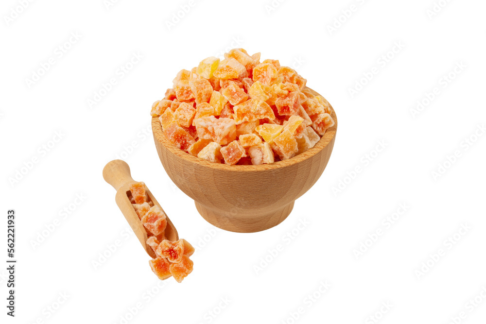 diced candied papaya in wooden bowl and scoop isolated on white background. nutrition. food ingredient. diced candied papaya in wooden bowl and scoop isolated on white background. nutrition. food ingredient.