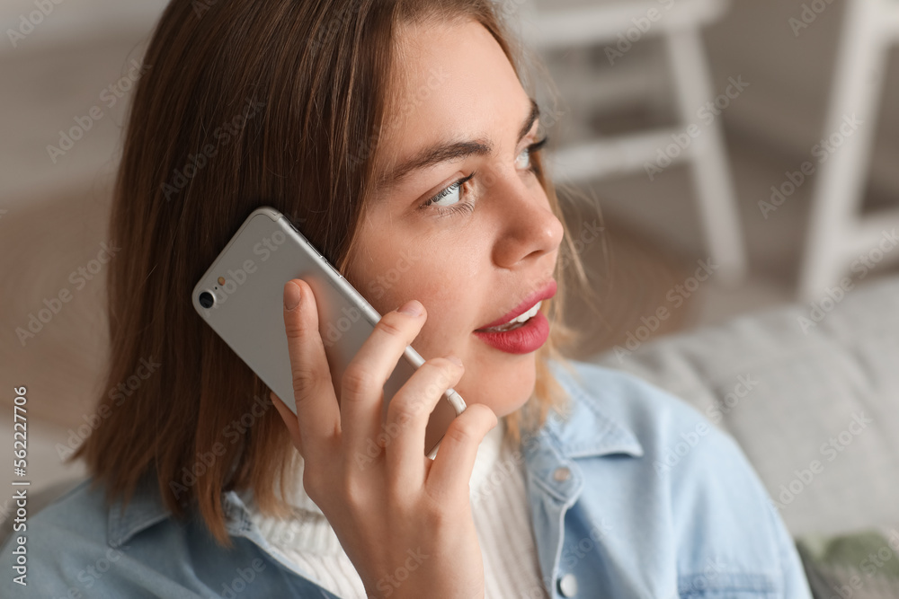 Young woman talking by smartphone at home, closeup Young woman talking by smartphone at home, closeup