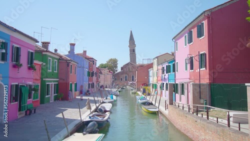 View of picturesque Venetian Burano island with pretty colorful houses and long narrow canal in sunny morning Venice Italy