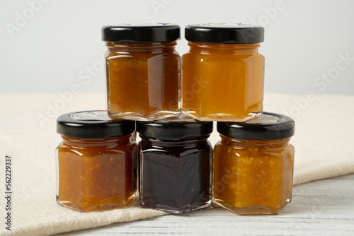 Set of glass jars with a variety of jams. Small jam jars with homemade jam. Different marmalade in small jars