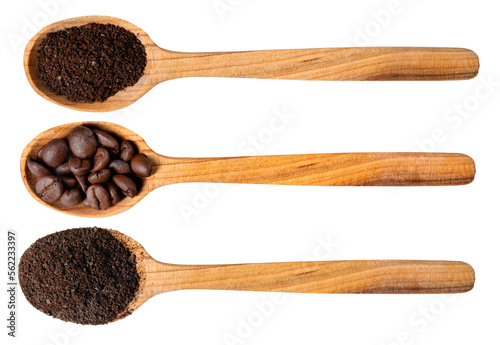 Three wooden spoons with ground coffee and whole beans on an isolated background.