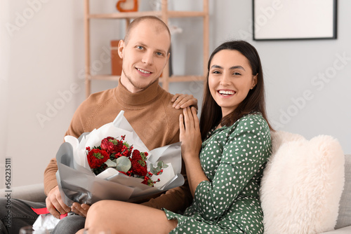Happy Couple with Red Flowe...