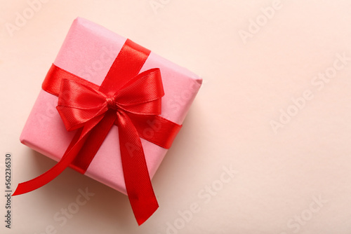Beautiful gift with red ribbon on white background. Valentine's Day celebration