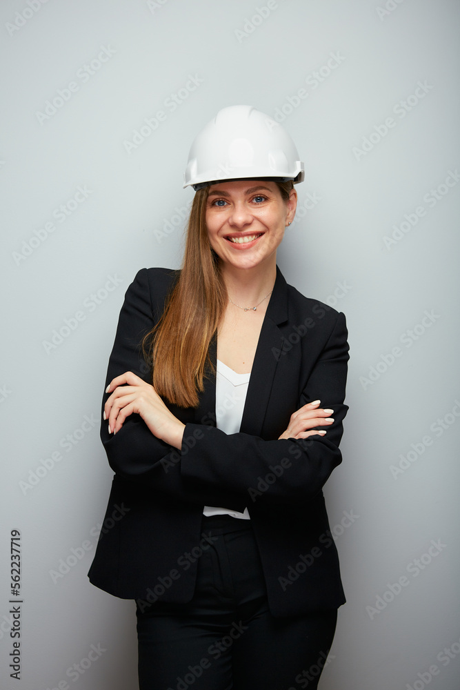 Woman engineer smiling and happy wearing safety helmet and black office suit. Woman engineer smiling and happy wearing safety helmet and black office suit.