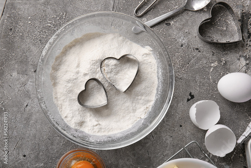Bowl of flour, cookie cutte...