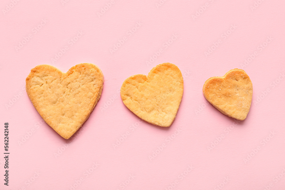 Sweet heart shaped cookies on pink background. Valentines Day celebration