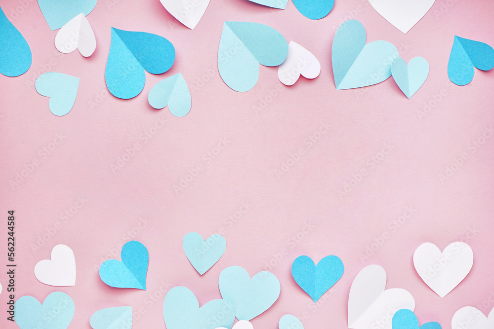 Composition with blue and white paper hearts on pink background. Valentines Day celebration