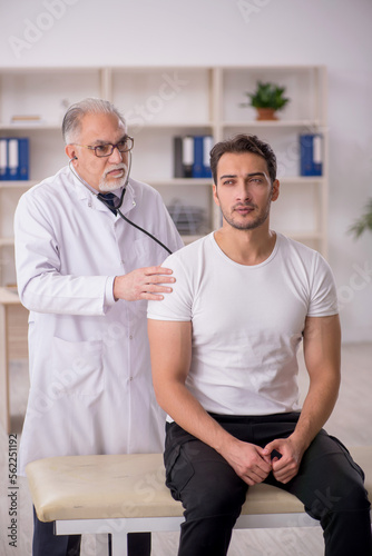 Young male patient visiting old male doctor