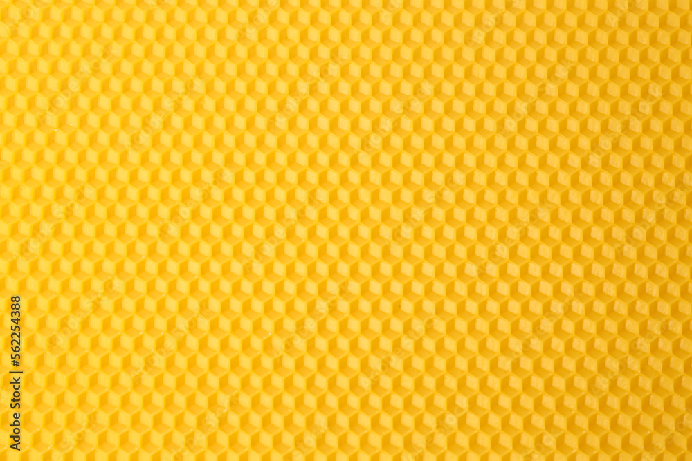Natural beeswax sheet as background, top view