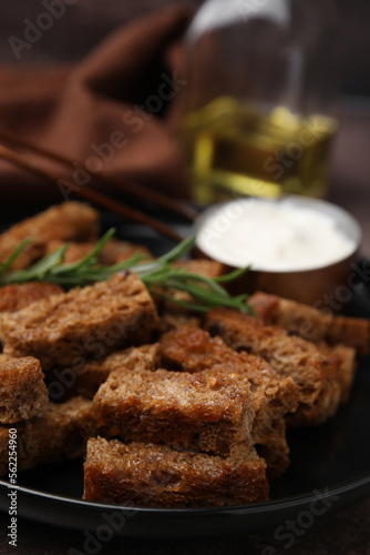 Crispy rusks with rosemary on plate  closeup