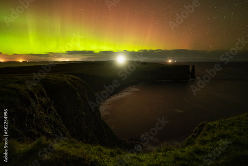 Northern lights over lighthouse at Duncansby head, Caithness, Scotland photo