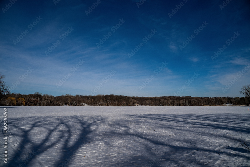 Frozen Lake on Clear Sunny Afternoon Frozen Lake on Clear Sunny Afternoon
