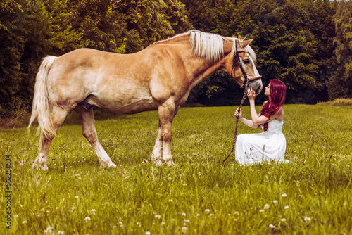 Принти на полотні red haired woman with white dress sit on green pasture next to brown horse and l