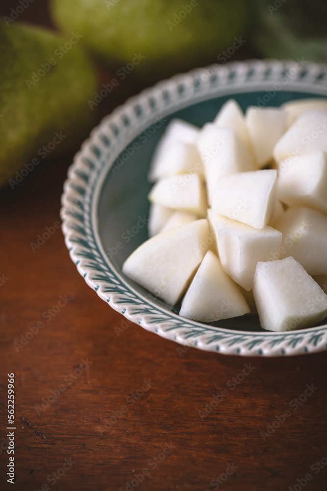 Close Up of Bowl of Chopped Bartlett Pears on Wooden Table Close Up of Bowl of Chopped Bartlett Pears on Wooden Table