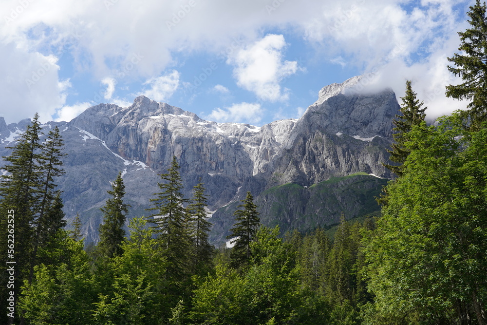 Fototapeta premium landscape with clouds in the mountains, blue sky, snowy peaks