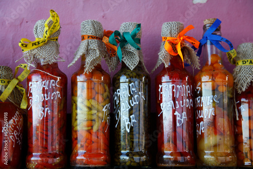 Colorful preserved fruits vegetables and chilli peppers souvenirs, Arraial d'Ajuda, Bahia, Brazil. photo