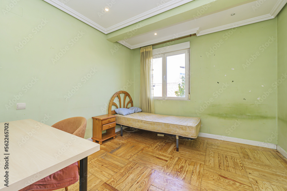 Fototapeta premium Old and dirty bedroom without sheets on the individual mattress