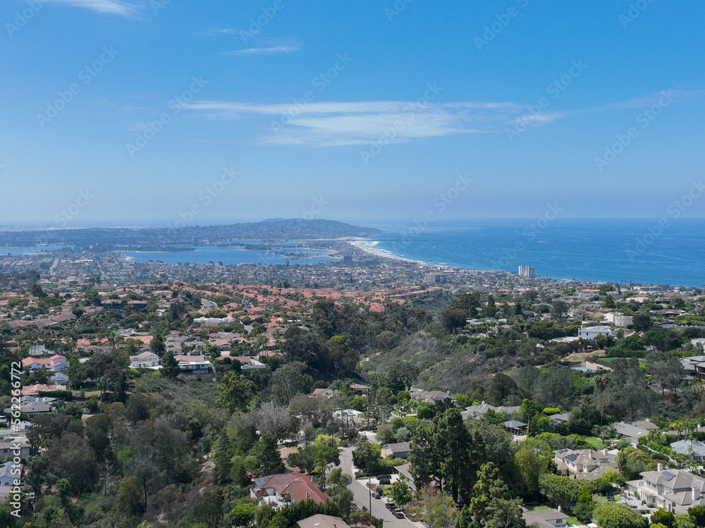 Aerial view over La Jolla Hills with big villas and ocean in the background, San Diego, California, USA