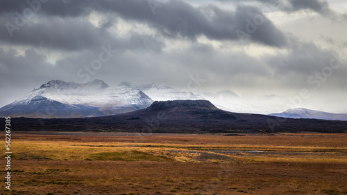 Elborg crater in Snaefellsnes Peninsula Iceland with snowy mountains in background photo