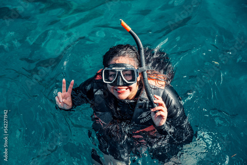Girl Smiles With her Snorkeling gear On In El Nido, Palawan, Philippines