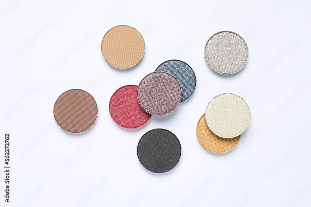 Different beautiful eye shadows on white background, flat lay Different beautiful eye shadows on white background, flat lay
