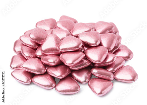 Pile of heart shaped candies on white background