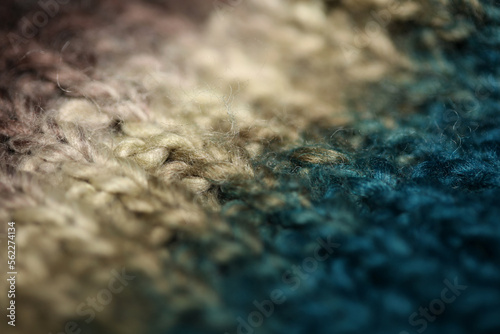 Colorful handmade winter traditional scarf with alpacas wool close up background modern high quality print