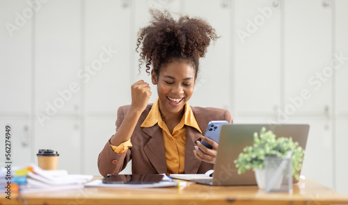 Excited happy Asian or african american woman business woman and phone screen in office for joy social media, internet browsing or research online win isolated over a white blur background