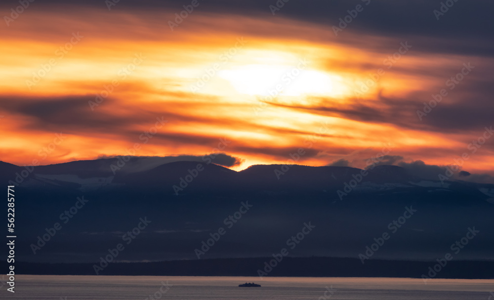 Fototapeta premium Vancouver Island Covered in Clouds during winter sunset. Viewed from Cypress Lookout, West Vancouver, British Columbia, Canada.