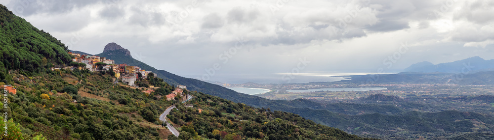 Small Touristic Town, Baunei, in the Mountains of Sardinia, Italy. Cloudy Rainy Day. Fall Season. Panorama