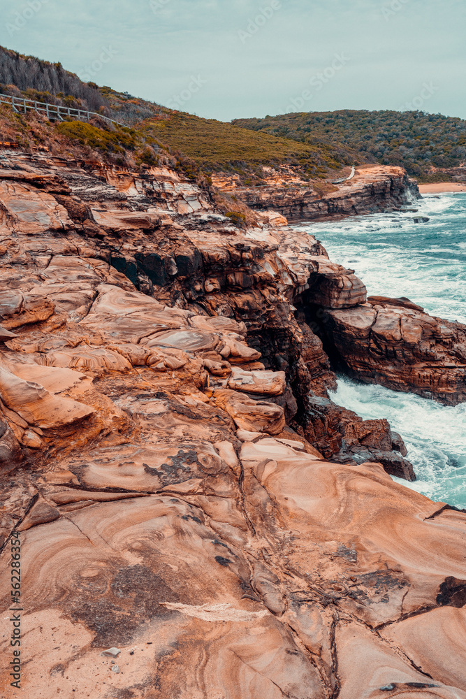 Naklejka premium Sandstone Swirls in Rock at Putty Beach, Australia