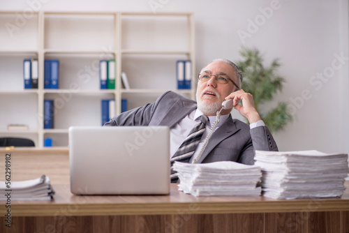 Old male employee and too much work in the office