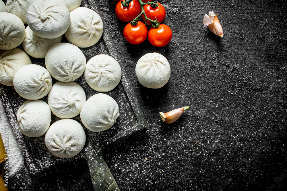 Raw manta dumplings with tomatoes on a branch. Raw manta dumplings with tomatoes on a branch.