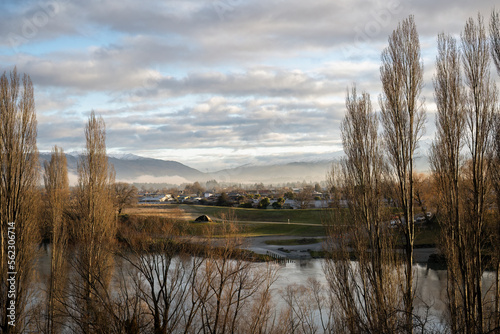 Obraz na płótnie Butchers Dam framed by trees in winter. Alexandra, Central Otago. w salonie