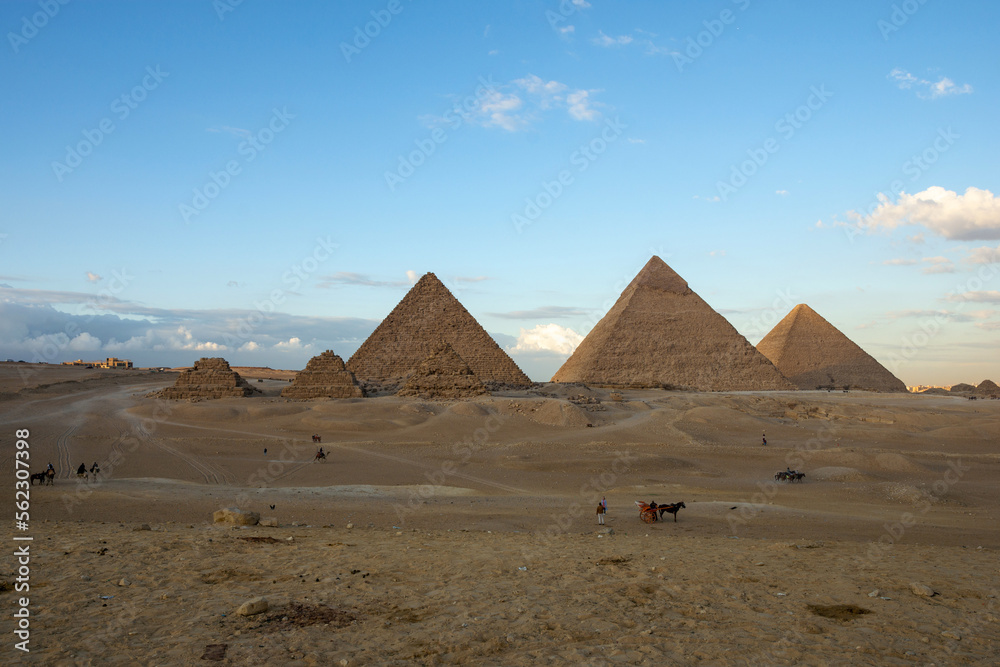 All three main pyramids of Giza. Pyramid of Menkaure, of Khafre or Chephren, of Khufu or Cheops and smal Queen’s pyramids.