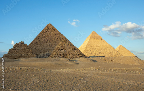 All three main pyramids of Giza. Pyramid of Menkaure, of Khafre or Chephren, of Khufu or Cheops and smal Queen’s pyramids. © Vladyslav Siaber