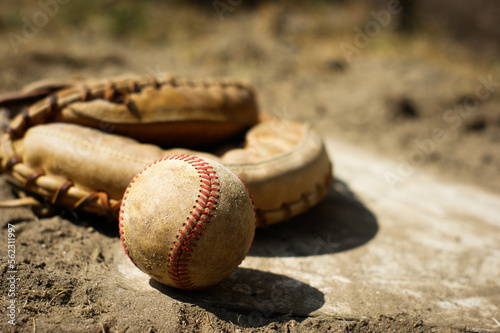 Baseball on home plate of ball field